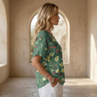 FJØRNA men's top, casual long-sleeve shirt with a relaxed fit, in dark color, displayed flat on a white background.