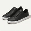 Men's FJØRNA leather lace-up low top sneakers showing black leather material and classic low profile design.