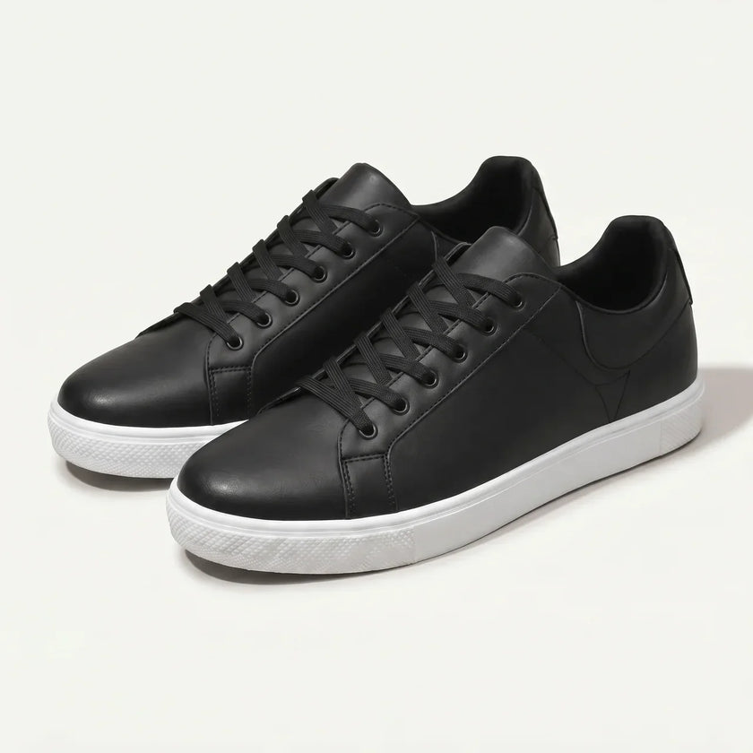 Men's FJØRNA leather lace-up low top sneakers showing black leather material and classic low profile design.