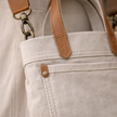 Large canvas messenger bag for women by FJØRNA, featuring a spacious design and adjustable shoulder strap.