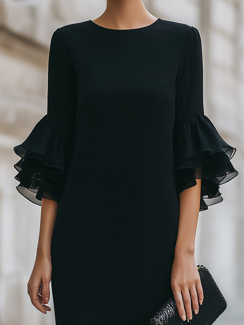 FJØRNA black dress with ruffled sheer sleeves, elegant sleeveless evening dress with flowy fabric and stylish design.