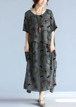 Gray linen cotton maxi dress by FJØRNA featuring a casual wedding dress style, with flowing fabric and relaxed fit.