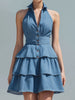 FJØRNA blue halter neck tiered ruffle denim mini dress with layered ruffles and sleeveless design, perfect for casual summer wear.