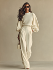 FJØRNA women's lightweight summer trousers featuring wide-leg and high waist design, shown in a natural fabric and relaxed fit.