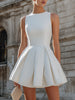 FJØRNA sleeveless structured pleated mini dress with fitted bodice and flared skirt, showcasing elegant pleats and modern design.