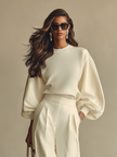 FJØRNA women's lightweight summer trousers with wide legs and high waist, shown on a model in a casual outfit.