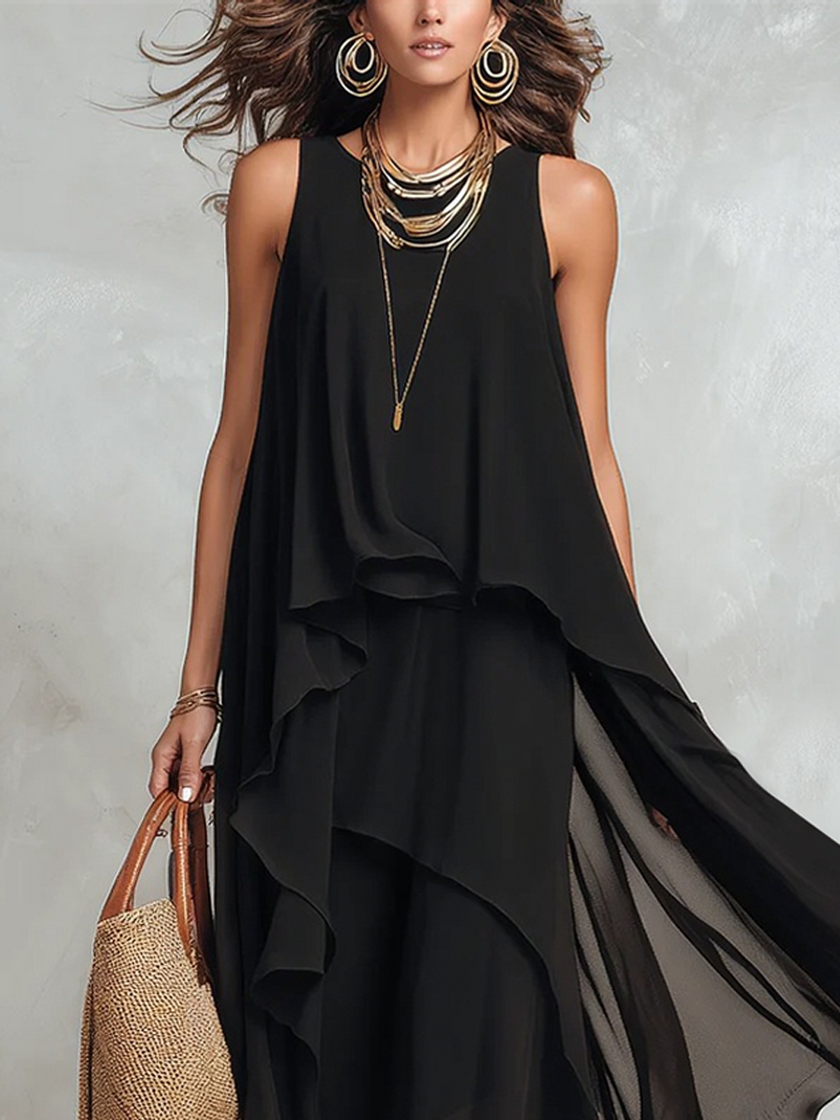 FJØRNA bohemian black layered chiffon maxi dress featuring flowing fabric and layered design, perfect for elegant summer occasions.