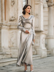 FJØRNA draped cowl neck long evening gown with sleeves, elegant maxi dress in flowing fabric, suitable for formal events.