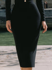 FJØRNA black and white contrast collar fitted midi dress with long sleeves and sleek silhouette, stylish and elegant for various occasions.