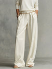 FJØRNA women's lightweight summer trousers with wide legs and belt, casual and breathable for warm weather.