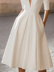 FJØRNA elegant deep V-neck pleated A-line midi dress with flowing fabric and stylish design, perfect for formal occasions