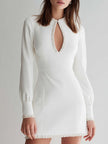 FJØRNA white long-sleeve mini dress with pearl-embellished keyhole neckline and fitted silhouette, perfect for elegant occasions.