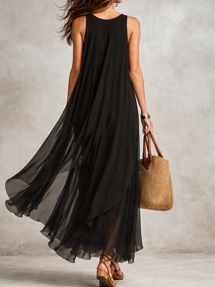 FJØRNA bohemian black layered chiffon maxi dress with flowing fabric and layered skirt, perfect for elegant casual wear.