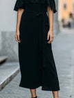 FJØRNA elegant cold-shoulder midi dress with ruffle details for women, stylish and perfect for dressy occasions.