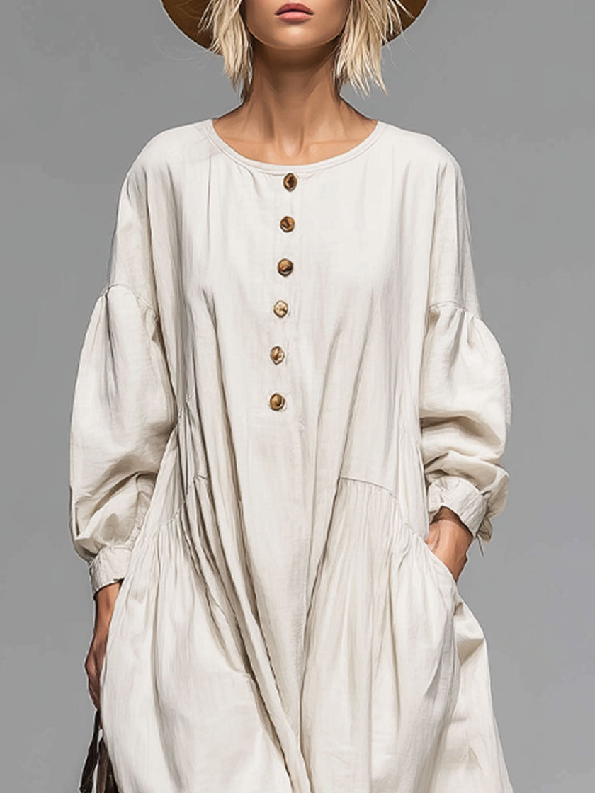 FJØRNA cotton button-front midi dress for women, featuring a classic design with button details and a comfortable fit.