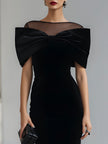 FJØRNA black velvet bow midi dress for women, elegant midi dress with a dramatic bow detail, suitable for formal occasions.
