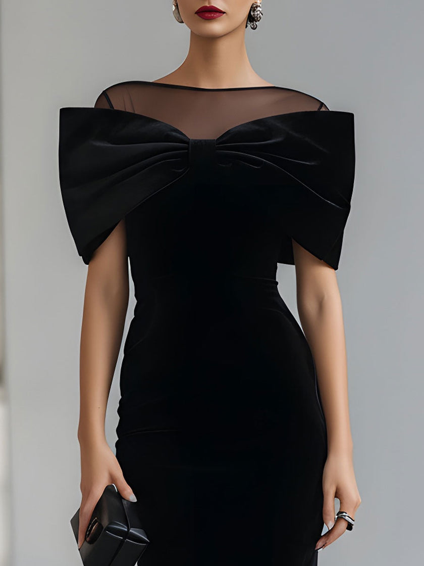 FJØRNA black velvet bow midi dress for women, elegant midi dress with a dramatic bow detail, suitable for formal occasions.