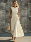 Cream chiffon pleated maxi dress by FJØRNA featuring a casual, flowy design with pleats and a relaxed fit.