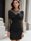 White pearl-embellished bow mesh sleeve mini dress by FJØRNA, featuring elegant design and sheer mesh details.