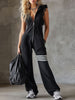 FJØRNA black sleeveless hooded jumpsuit with white striped pattern, casual style, front pockets, and relaxed fit.