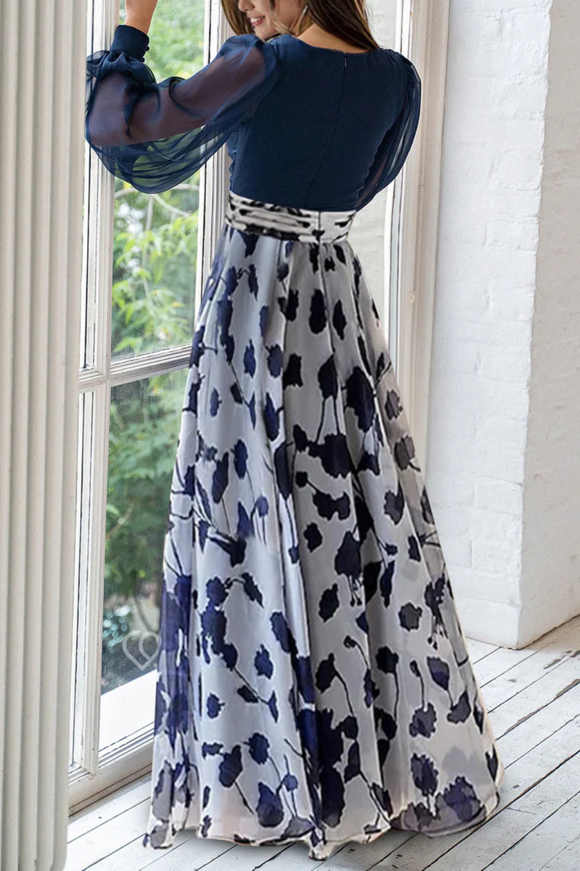 FJØRNA floral print maxi wedding guest dress with V-neck, balloon sleeves, and elegant floral design for special occasions