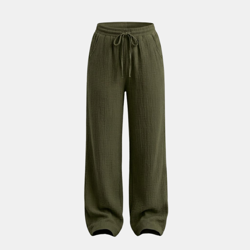 Women’s cotton wide-leg trousers from FJØRNA, casual lightweight pants in neutral color, with a relaxed fit and flowing silhouette.