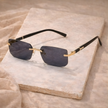 Unisex retro sunglasses by FJØRNA with dark lenses and thick black frames, stylish accessory for men.