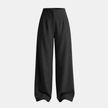 Women’s high waisted tailored wide leg trousers by FJØRNA, showing the beige pants with a high waist and wide-leg fit.