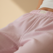 FJØRNA women's lounge trousers with elastic waist and pockets, comfortable casual pants for relaxed wear.