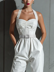 Ivory cotton-linen jumpsuit for women with V-neck, cinched waist, and wide-leg pants by FJØRNA, displayed on a model.