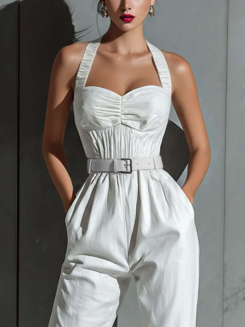 Ivory cotton-linen jumpsuit for women with V-neck, cinched waist, and wide-leg pants by FJØRNA, displayed on a model.