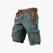 Men's FJØRNA cargo shorts with functional pockets, showing a relaxed fit and multiple storage compartments.