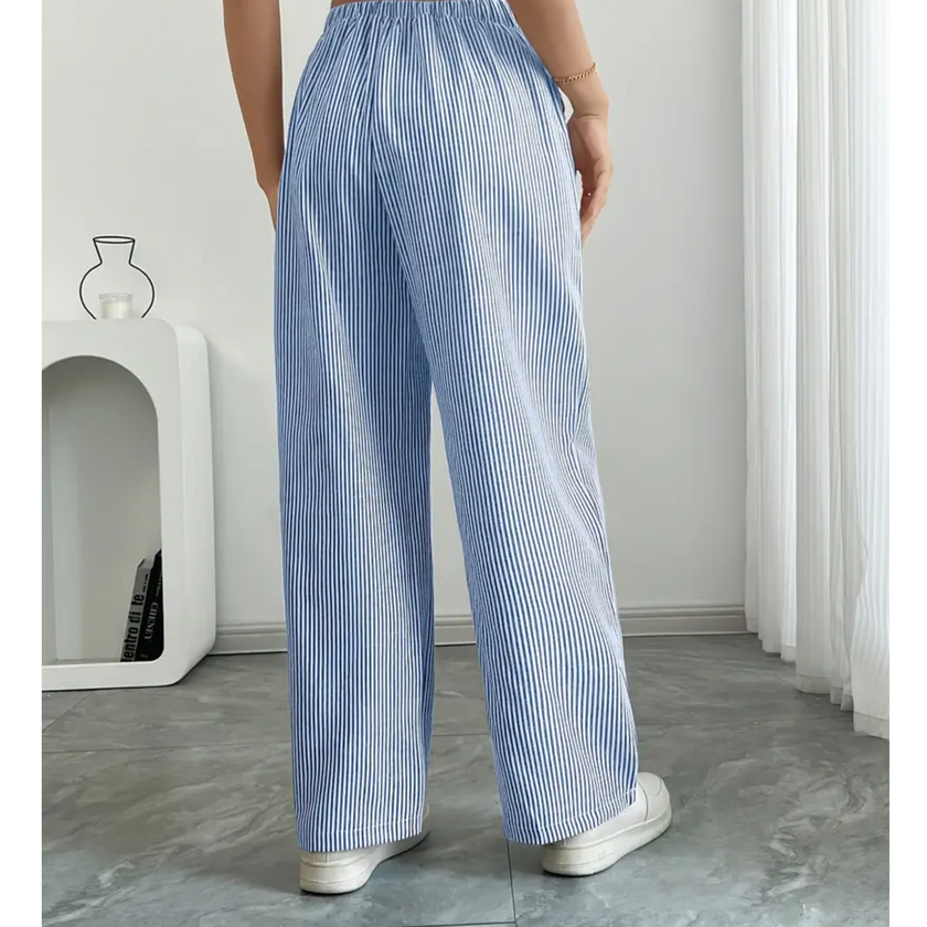 FJØRNA lightweight summer women's trousers with drawstring waist, breathable fabric, and side pockets, ideal for warm weather.