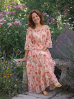 FJØRNA women's summer maxi dress with floral print and ruffle details, flowing fabric perfect for warm weather.