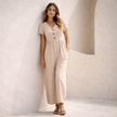 Women’s linen blend suit set with wide-leg pants and blazer by FJØRNA, shown in a stylish, neutral fabric with a relaxed fit.
