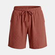 FJØRNA men's relaxed fit drawstring shorts with casual style, shown on a model, in neutral fabric with side pockets.
