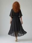 FJØRNA women's summer midi dress, flowy and lightweight, shown in a stylish design perfect for warm weather.