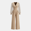 Women’s V neck mesh sleeve evening jumpsuit by FJØRNA, stylish women’s set with elegant V neckline and mesh sleeve details.