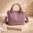 FJØRNA canvas tote bag for women with sturdy handles and natural beige fabric, perfect for everyday use.