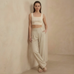 FJØRNA women's high waist wide leg pleated trousers, stylish and comfortable pants with a relaxed fit and modern design.