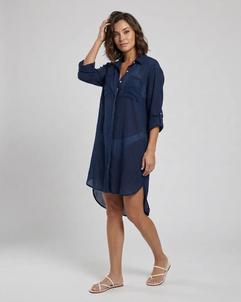 FJØRNA women's button-down cover-up mini dress with chest pockets, lightweight and casual for beach or poolside wear.