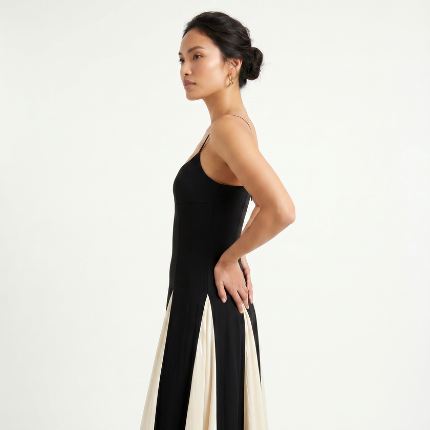 Women's contrast color maxi dress with spaghetti straps by FJØRNA, featuring a flowing silhouette and stylish color blocking.