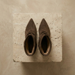 FJØRNA women's suede ankle boots featuring a stylish design with a rounded toe and low heel, perfect for casual wear.