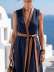 FJØRNA elegant sleeveless midi wrap dress for women, showcasing a sophisticated design with a fitted waist and flowing skirt.
