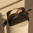 FJØRNA leather crossbody bag with chevron strap, genuine leather, compact women’s bag featuring adjustable strap and stylish design.