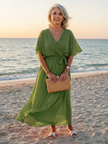 FJØRNA women's summer midi dress featuring a wrap design and flowy fabric, perfect for warm weather and casual outings.