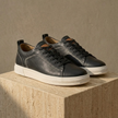 FJØRNA men's suede trainers, stylish casual shoes with beige suede uppers and white rubber soles, perfect for everyday wear.
