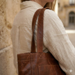 FJØRNA leather tote bag for women with anti-theft features, stylish travel bag in natural leather finish.