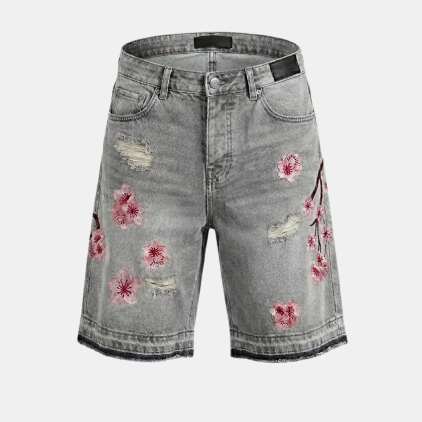 Men's denim shorts with floral pattern by FJØRNA, featuring a casual fit and stylish design, shown on a model.