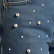 Relaxed fit baggy denim jeans for women by FJØRNA, showcasing the casual, comfortable style and classic blue denim fabric.